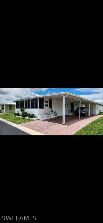 a view of house with a big yard