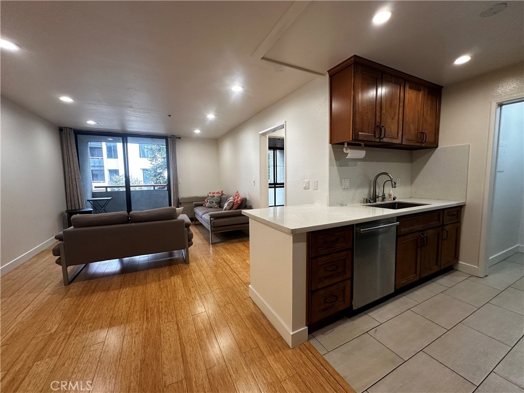 a kitchen with a sink and natural light