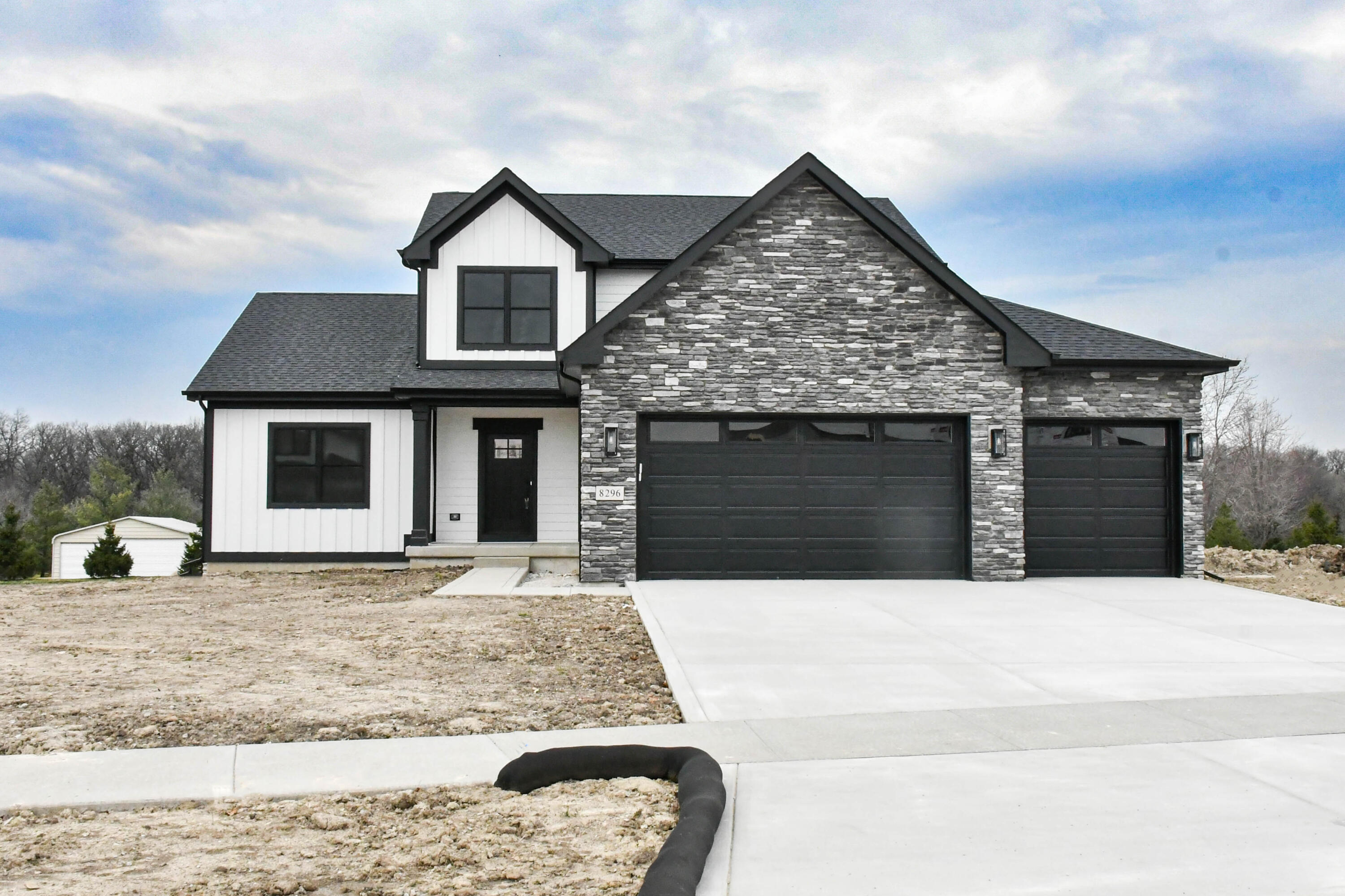 a front view of a house with yard