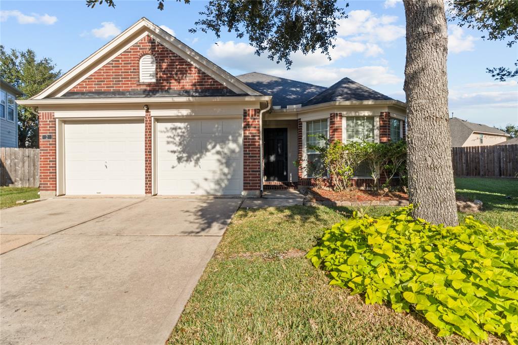 front view of a house with a small yard