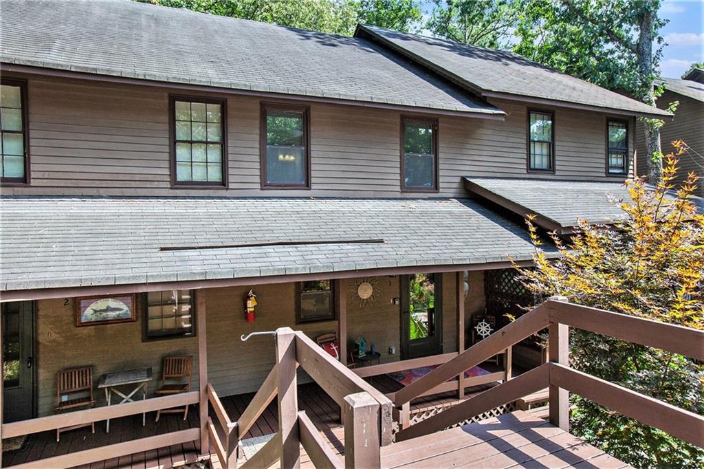 a view of house with outdoor seating area