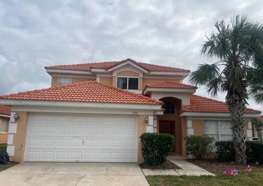 a front view of a house with a garage