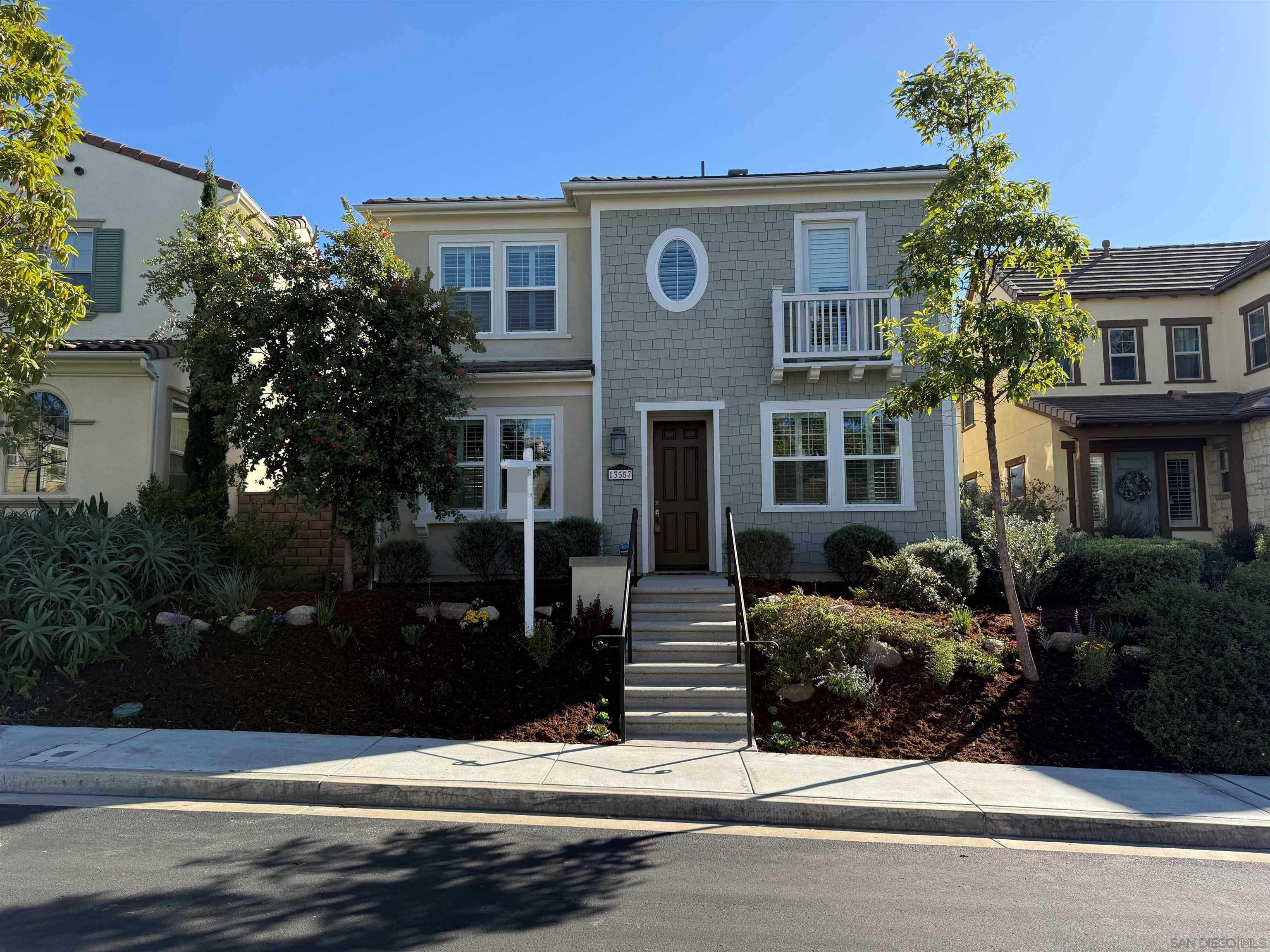 a front view of a house with yard