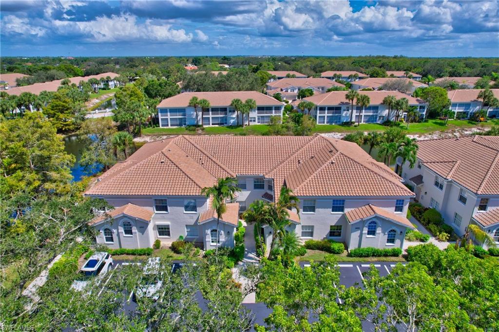 an aerial view of house with yard