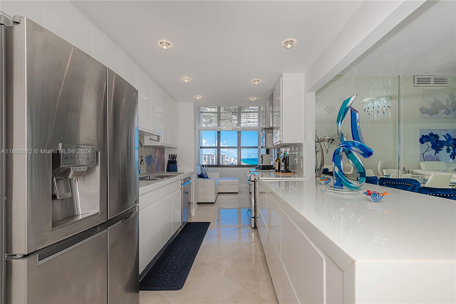 a kitchen with counter top space and stainless steel appliances