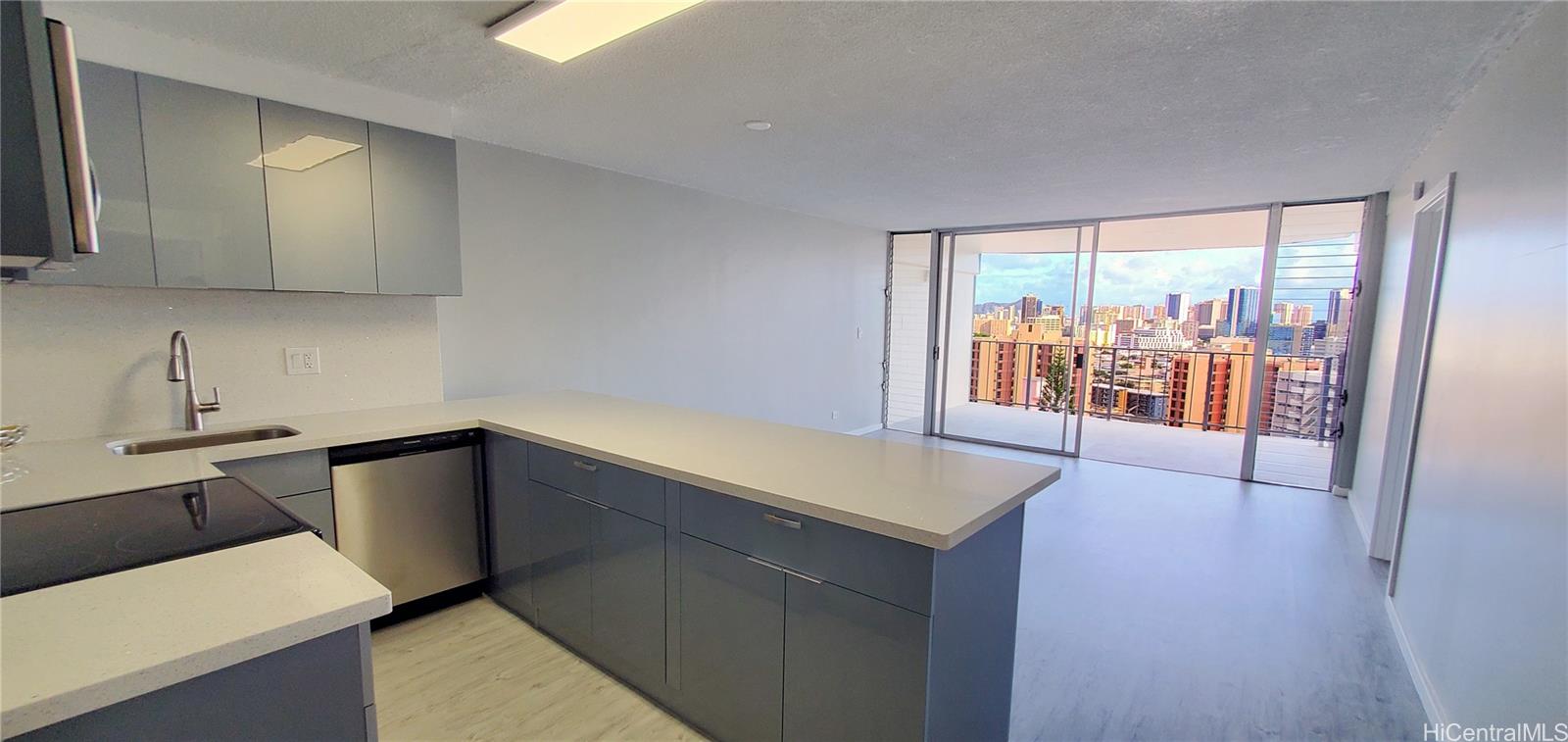 a kitchen with a sink window and cabinets