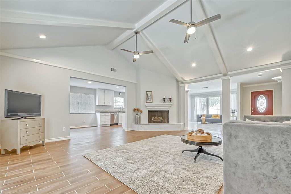 a living room with fireplace furniture and a flat screen tv