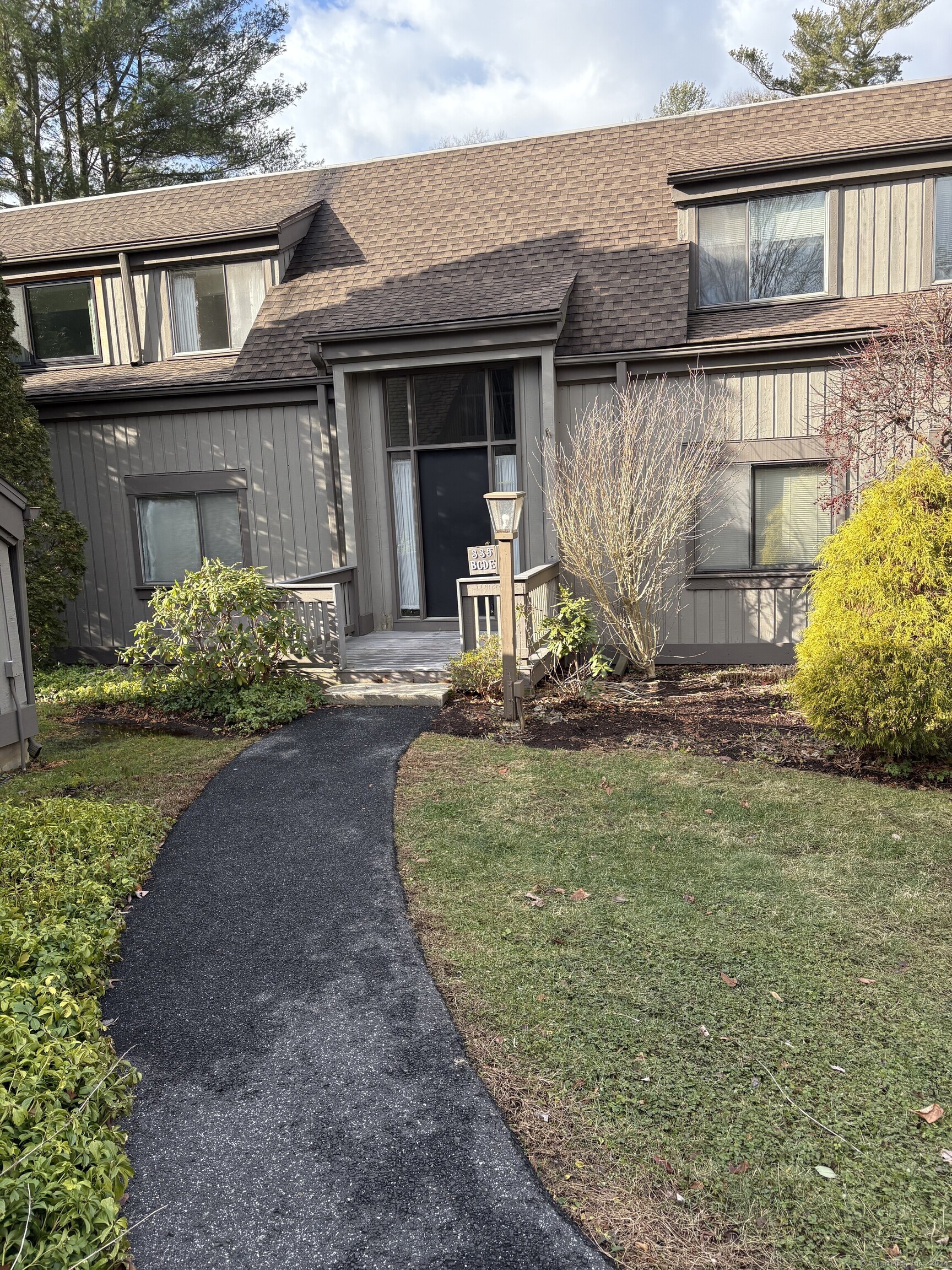 a front view of a house with garden