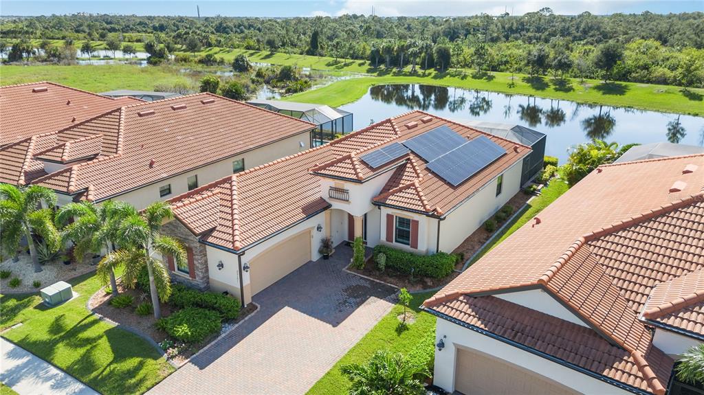 Welcome Home! Ariel view of the completely paid-off solar system that will power your new dream home in Sarasota National Golf Community!