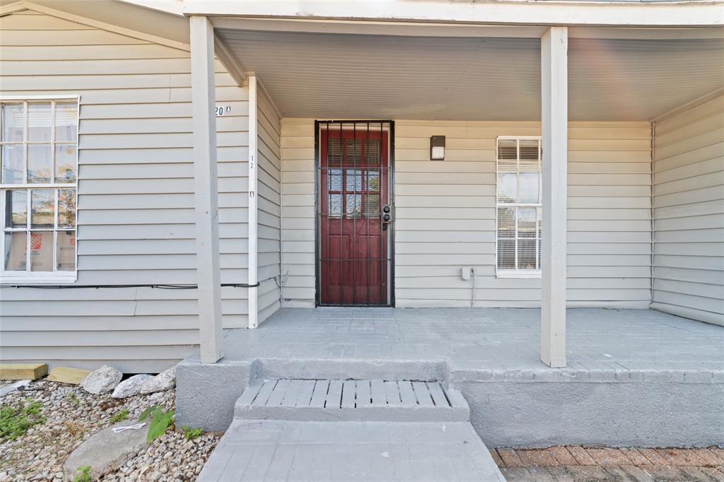 a view of a house with a door and a window