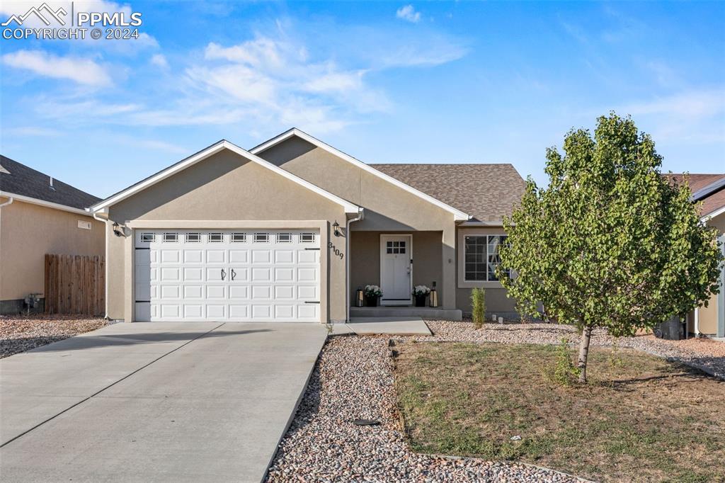 Single story home featuring a garage