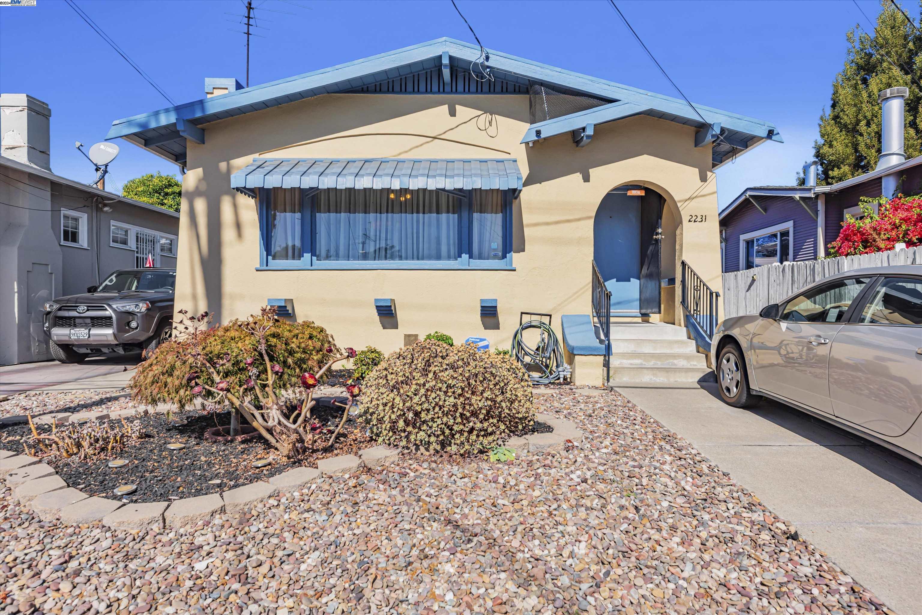 a front view of a house with garden