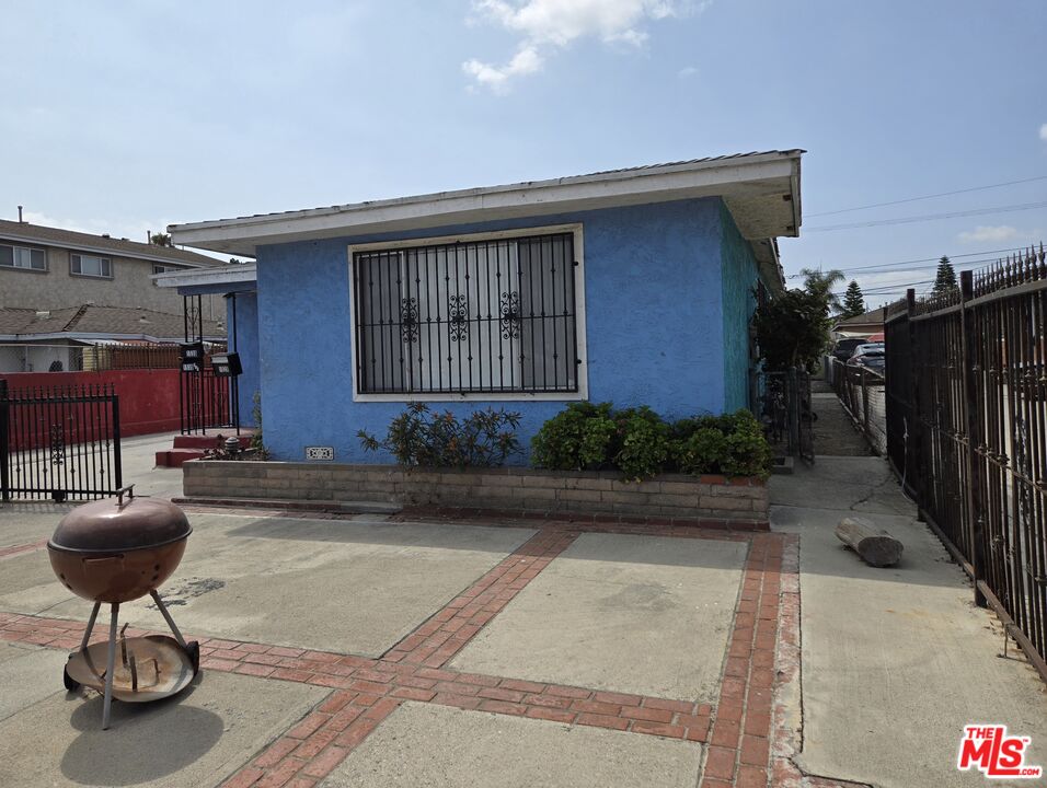 a front view of a house with fountain