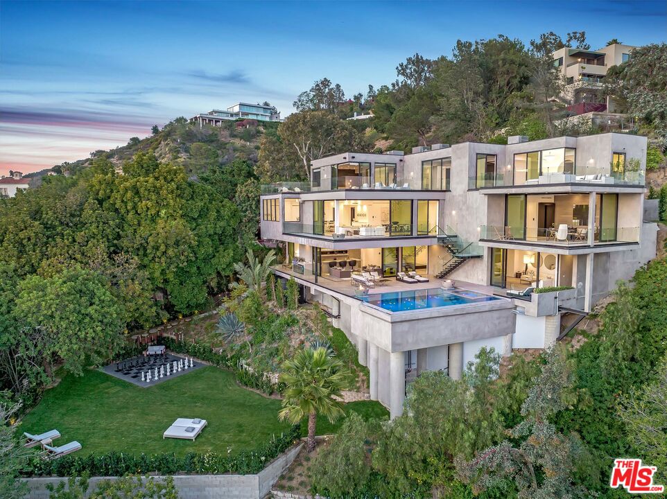 an aerial view of a house with a garden