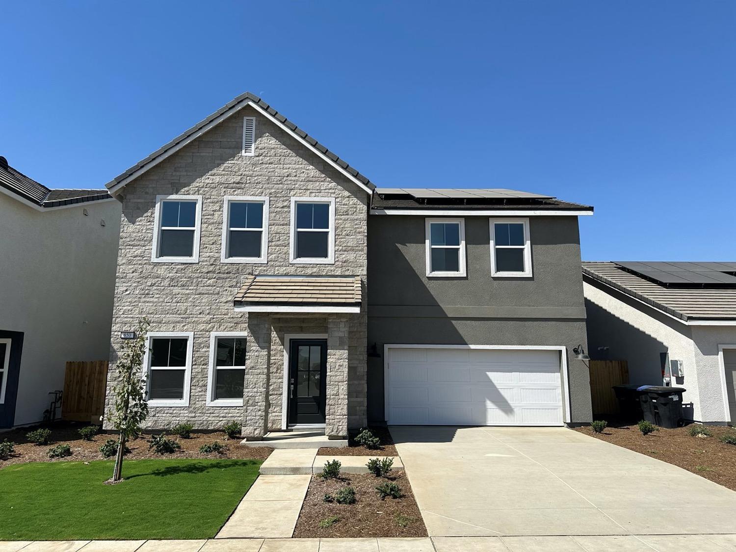 a front view of house with yard