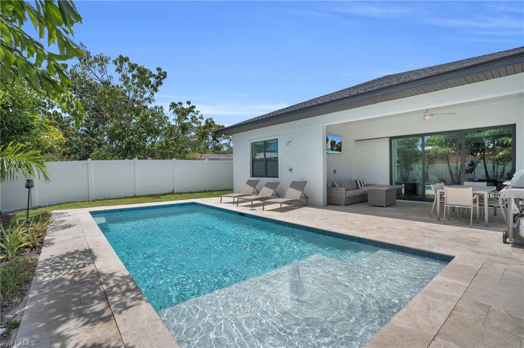 View of pool featuring a patio, an outdoor hangout area, and ceiling fan