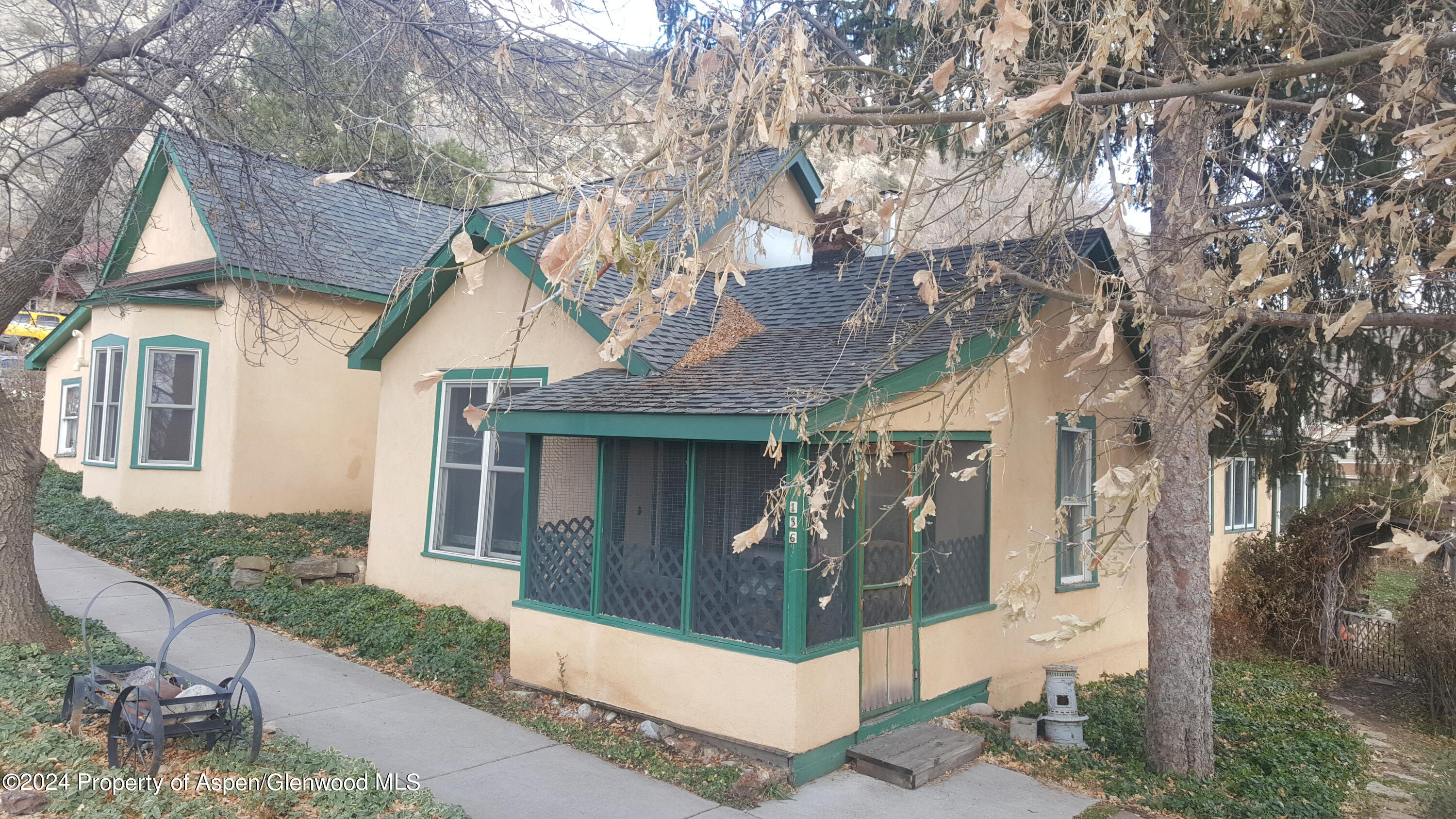 a view of a house with a tree