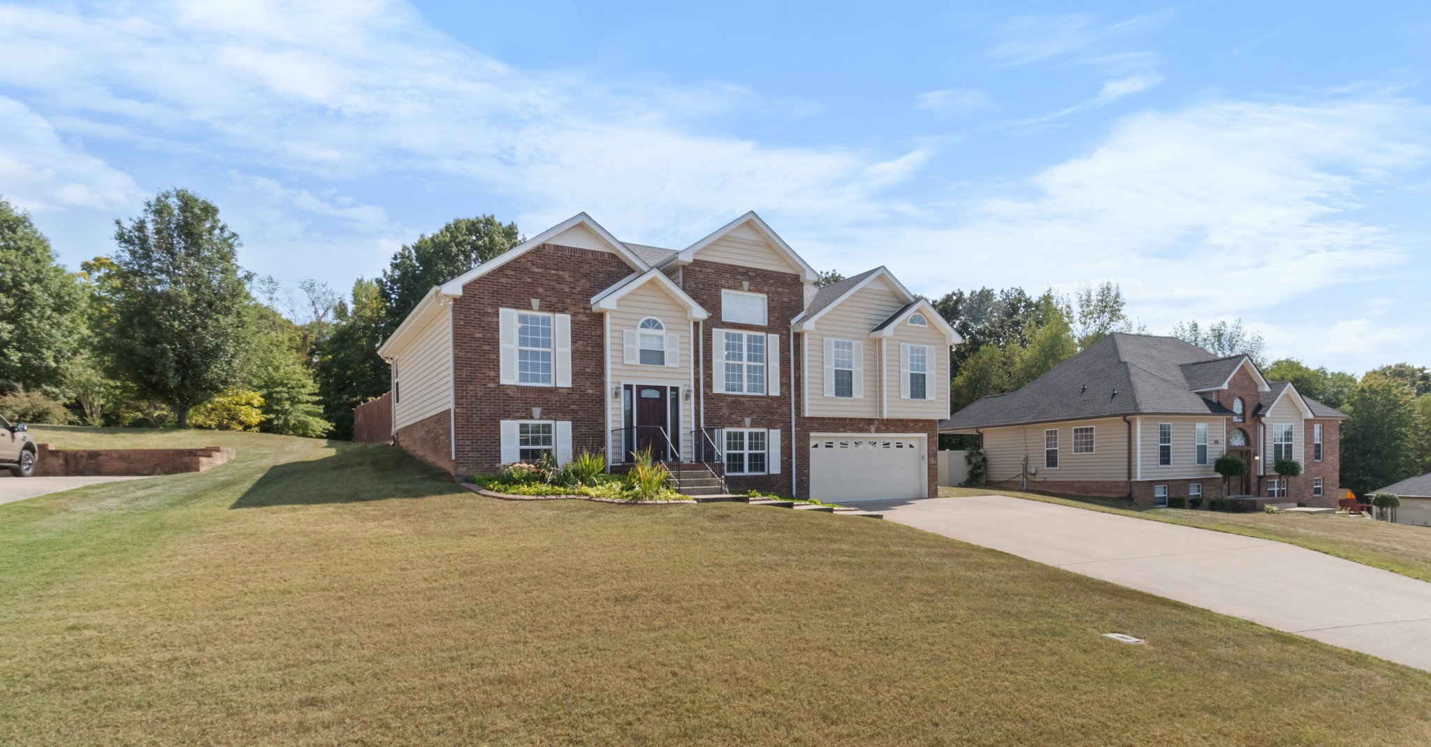 a front view of a house with a yard