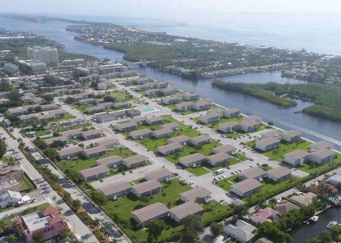 an aerial view of residential houses with outdoor space