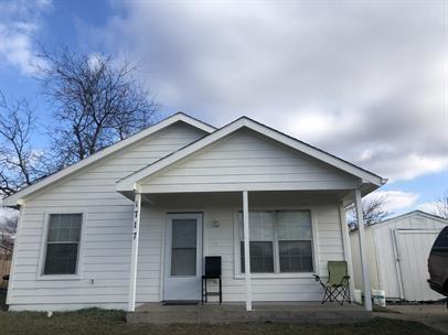 a front view of a house with garage