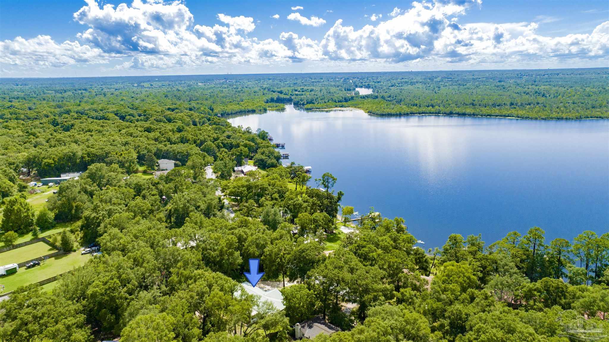 a view of a lake with a yard