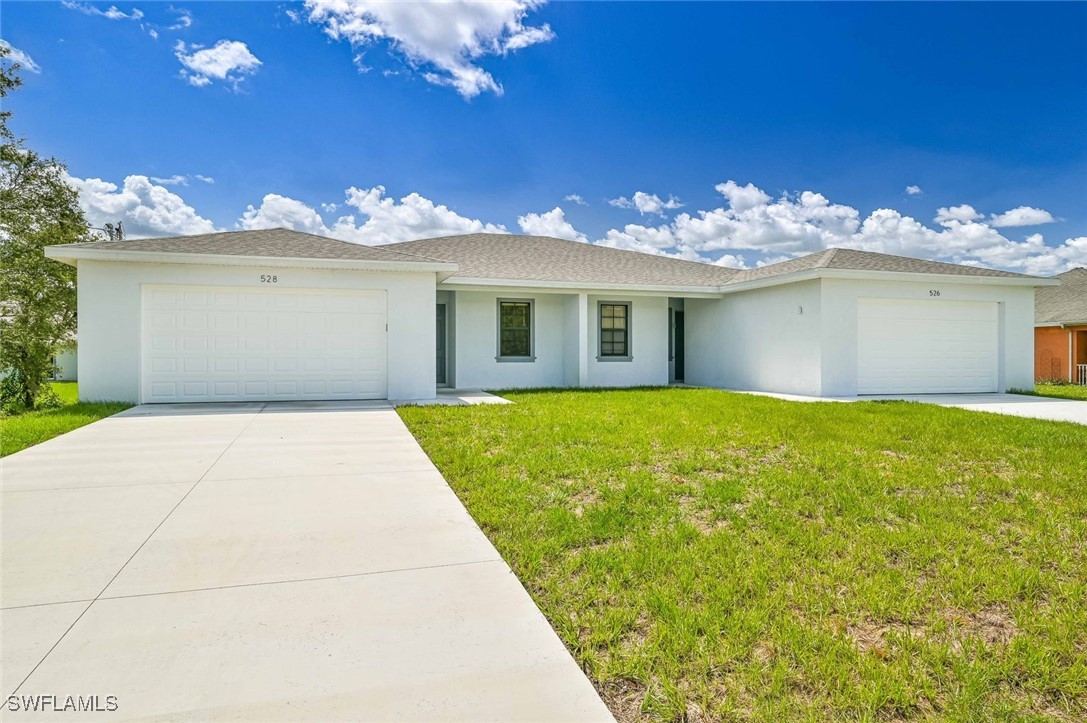 a front view of a house with a yard