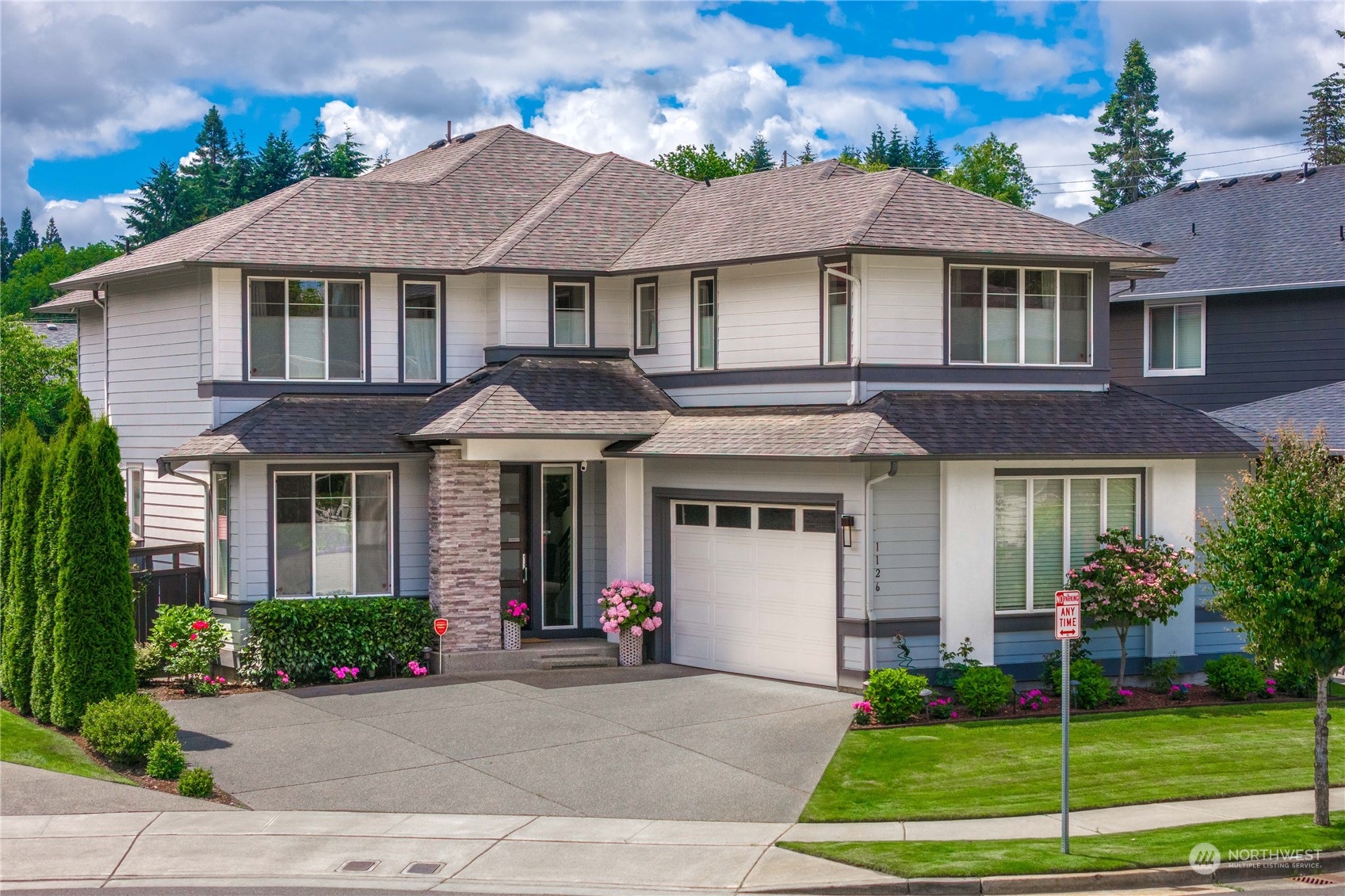 a front view of a house with a yard