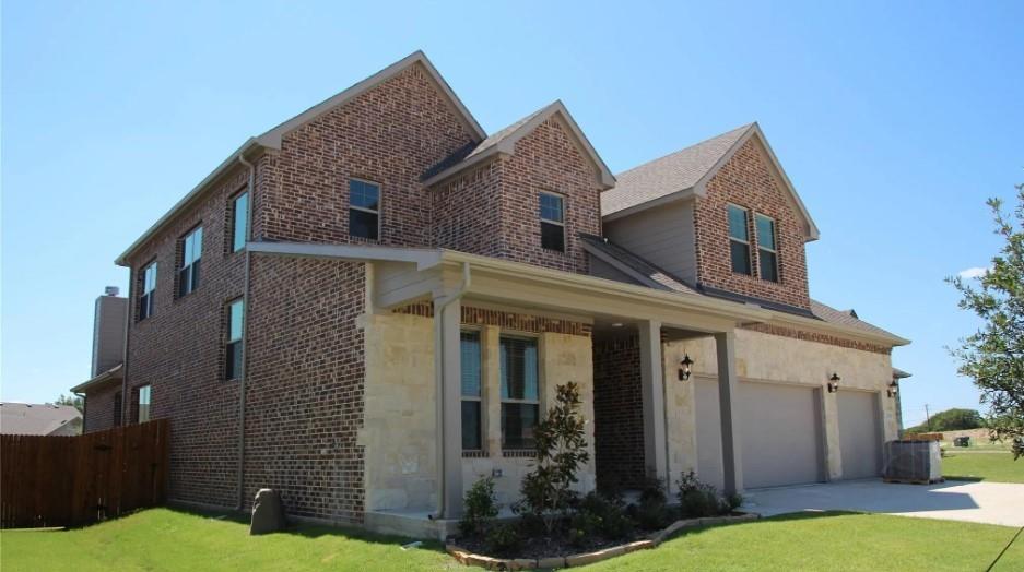 View of property exterior with a garage, a yard, and central air condition unit