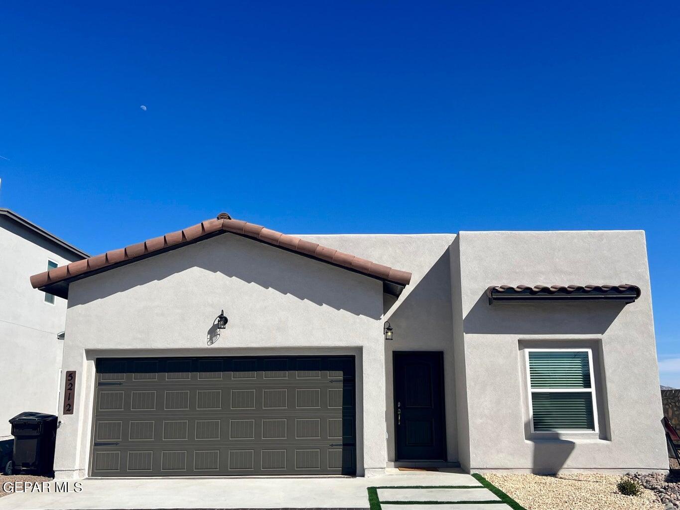 a view of a house with a garage