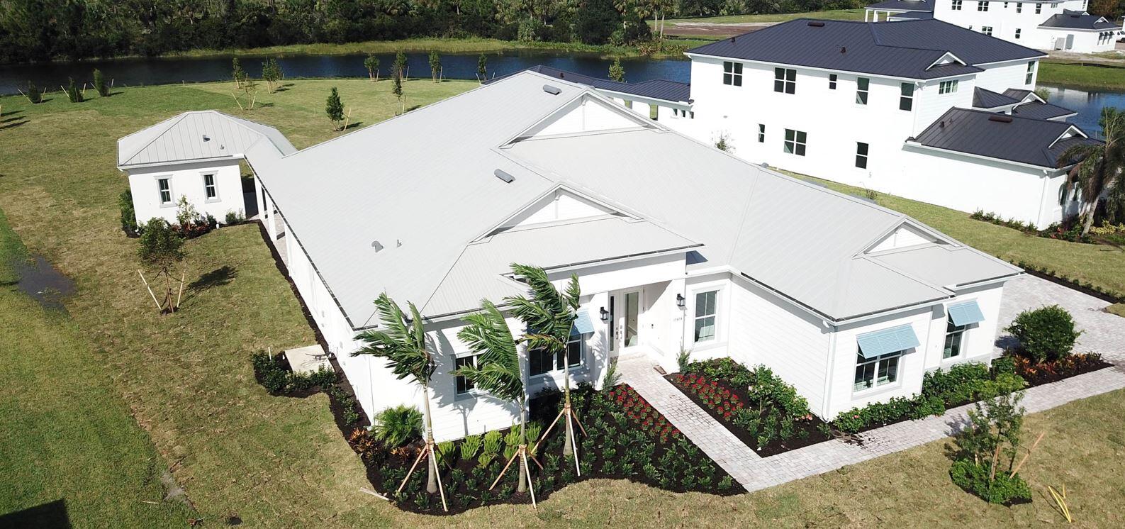 an aerial view of a house with a lake view