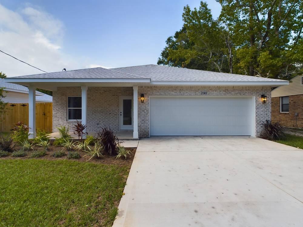 a front view of house with yard