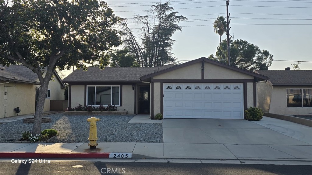 a front view of a house with a garage