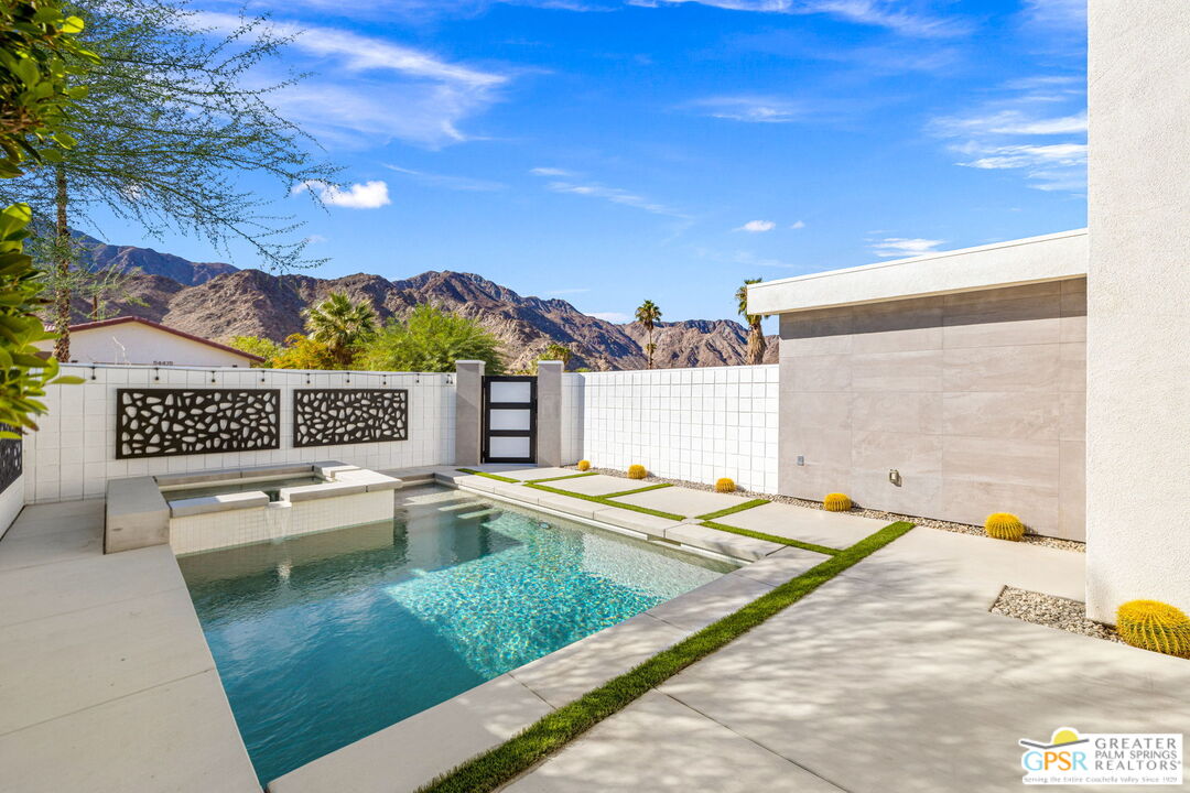 a view of a swimming pool with a lounge chairs