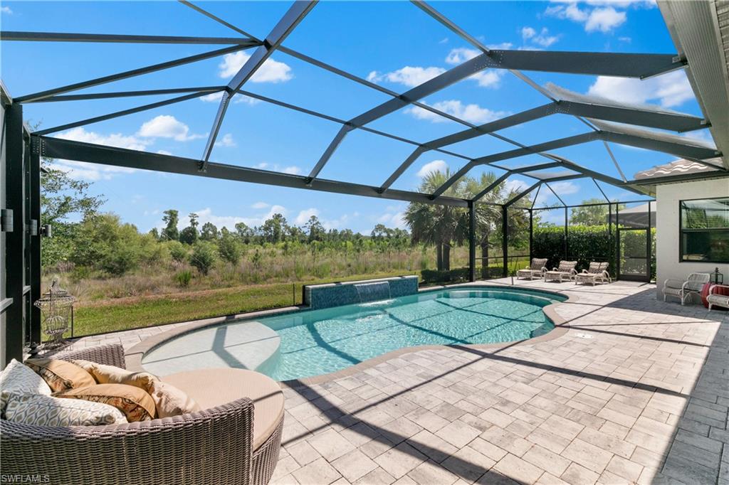 a view of a swimming pool with a patio