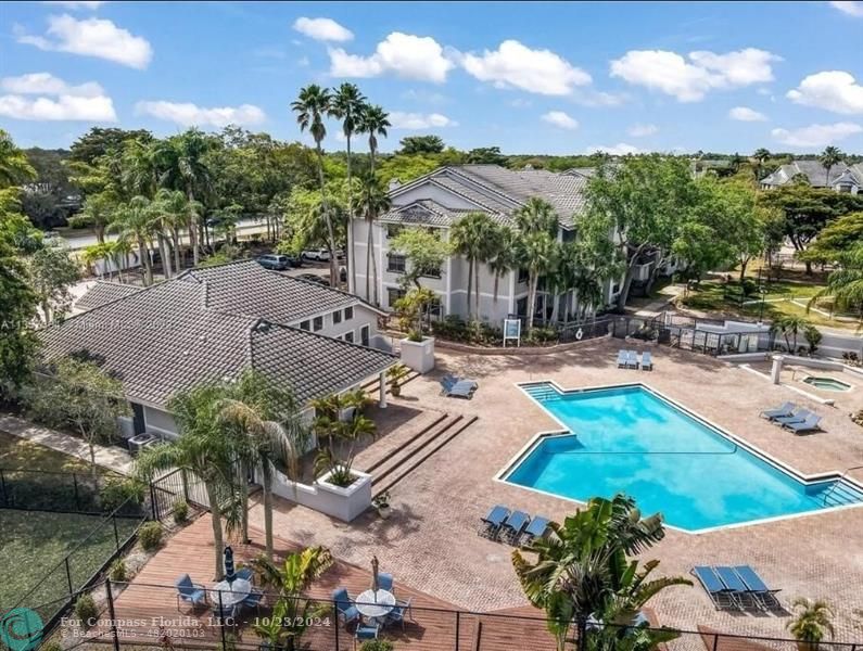 a view of a swimming pool with a patio