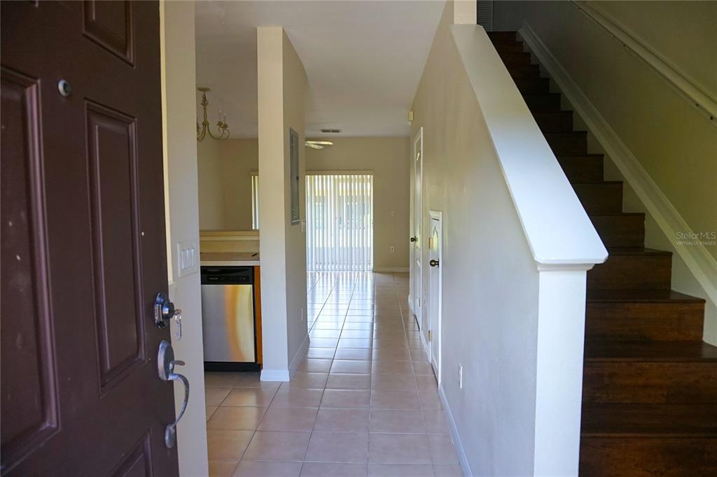 a view of a hallway with a wooden door