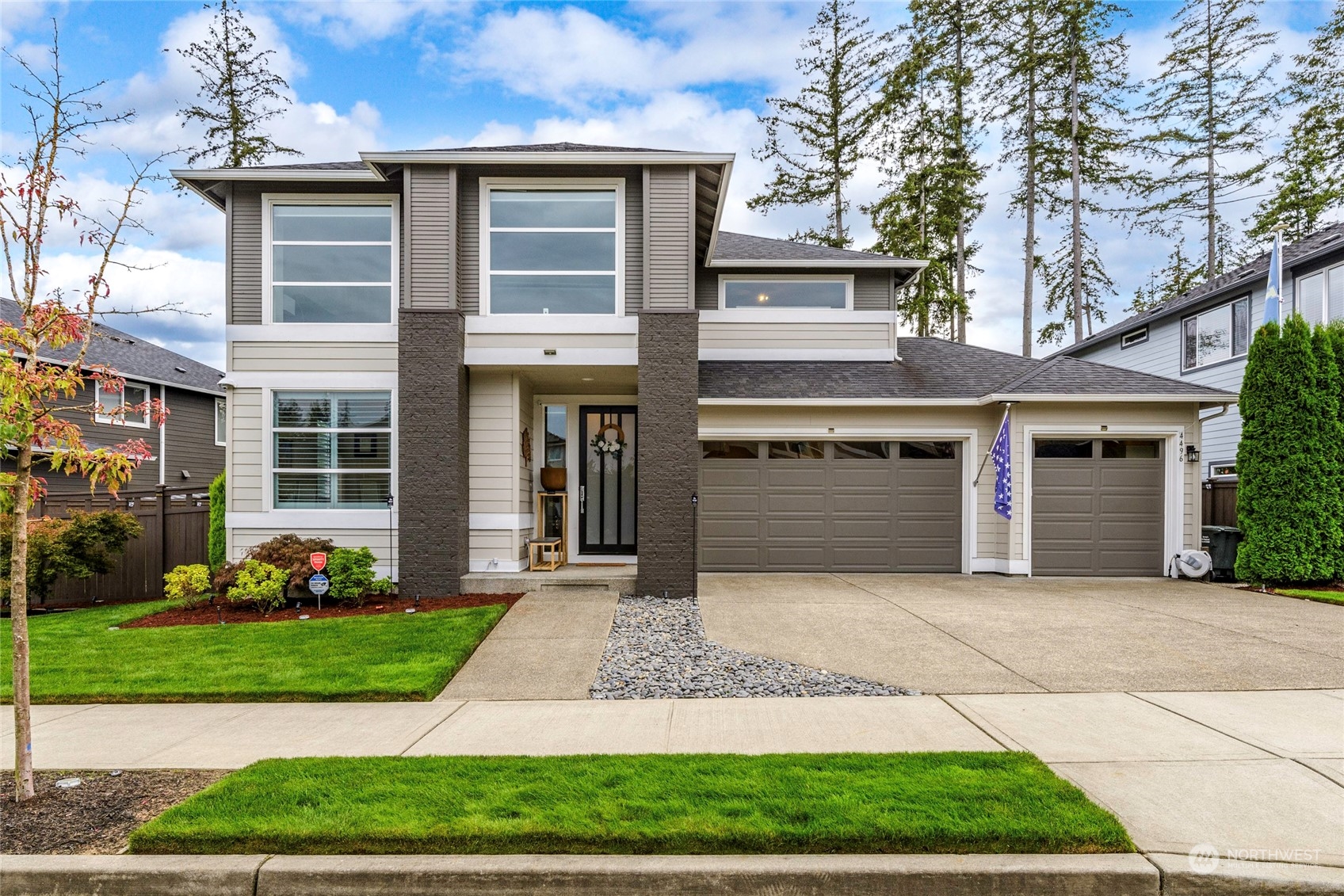 a front view of a house with garden