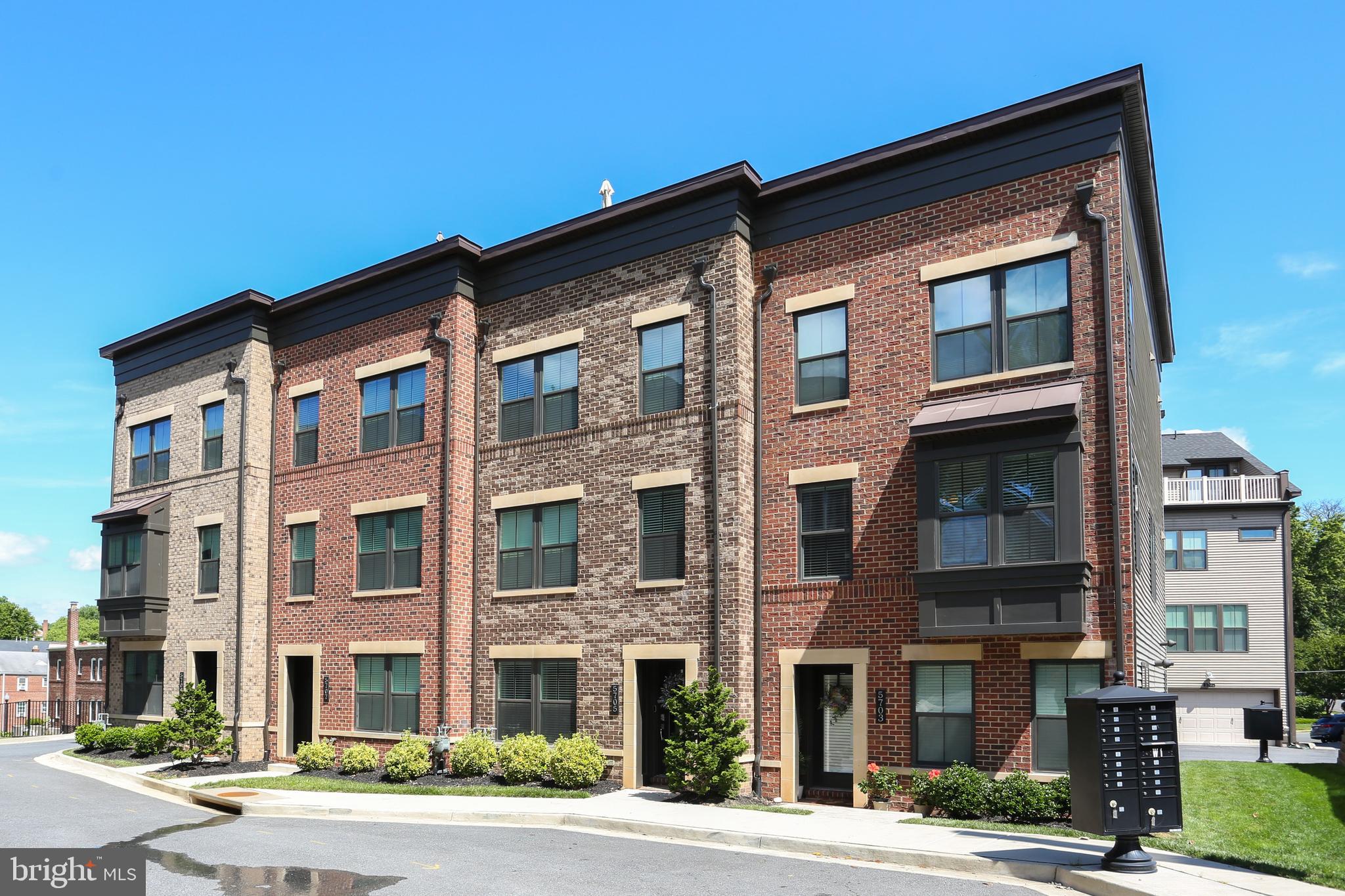 a front view of a building with a yard