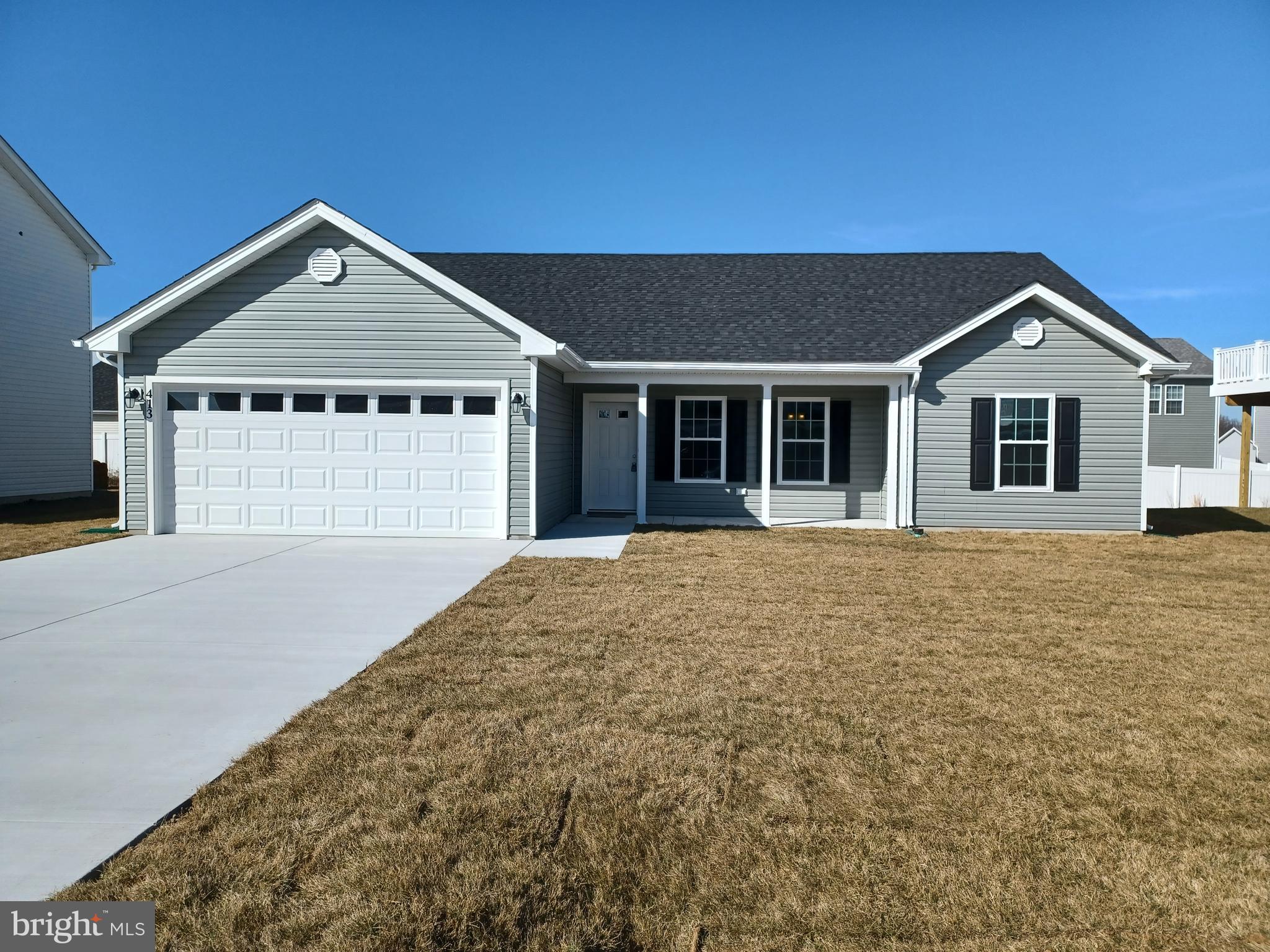 a front view of a house with yard