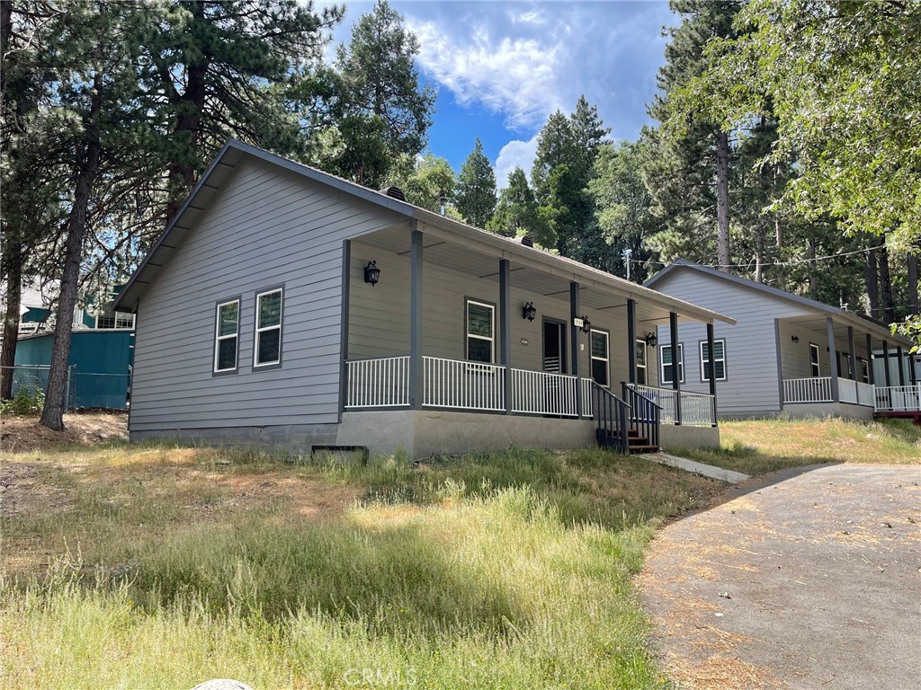 a view of a house with a yard