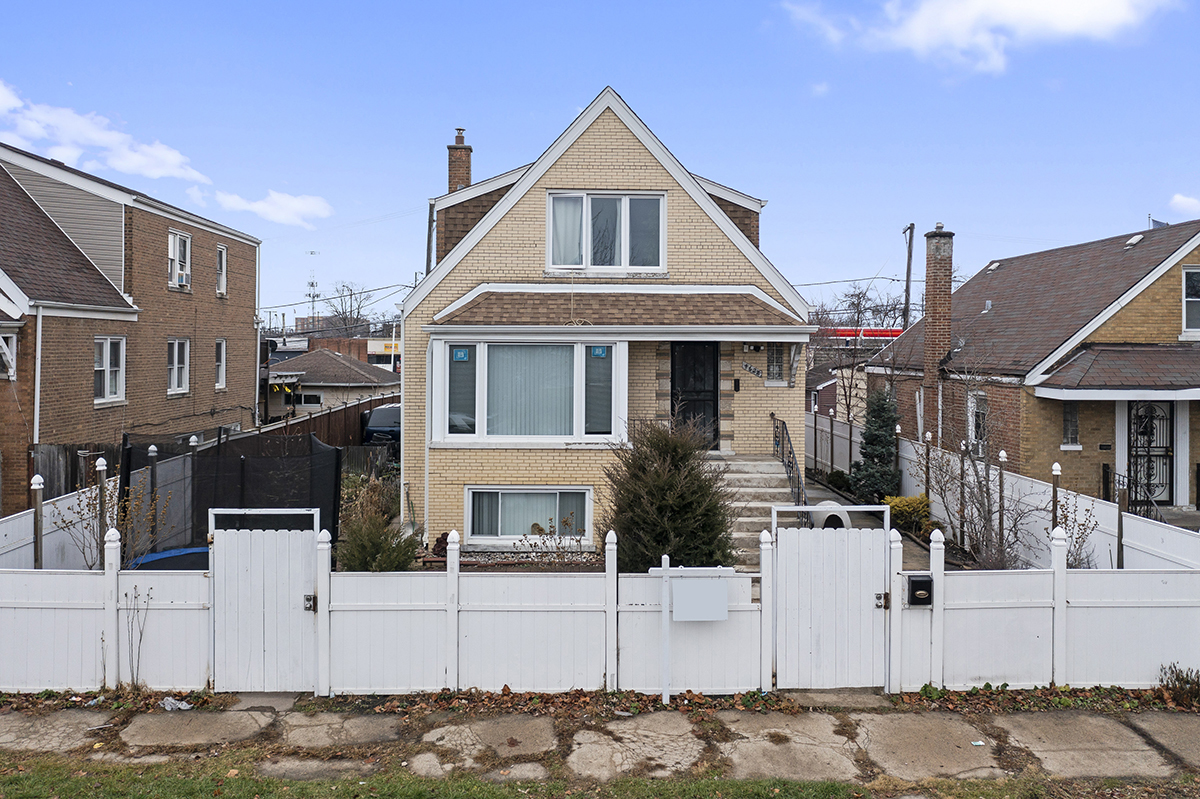 a front view of a house with garage