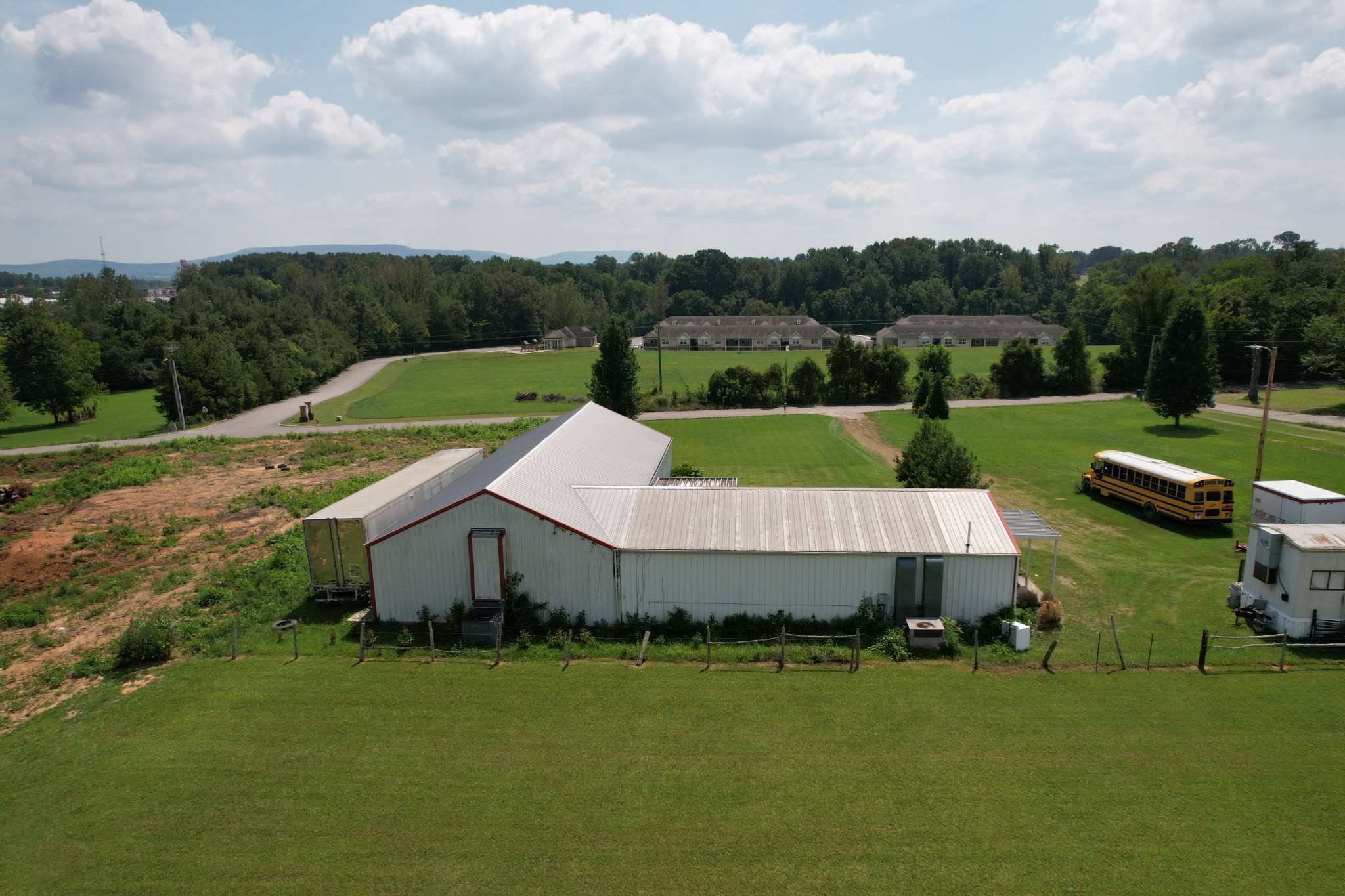 an aerial view of a house and outdoor space