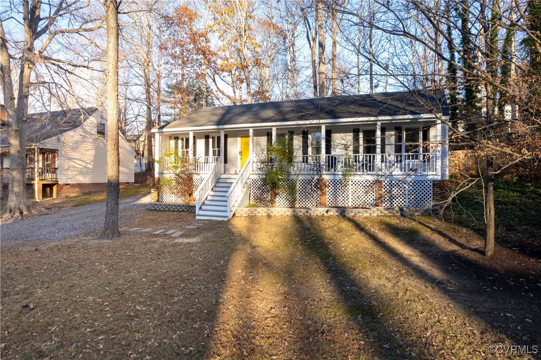 a view of house with a yard