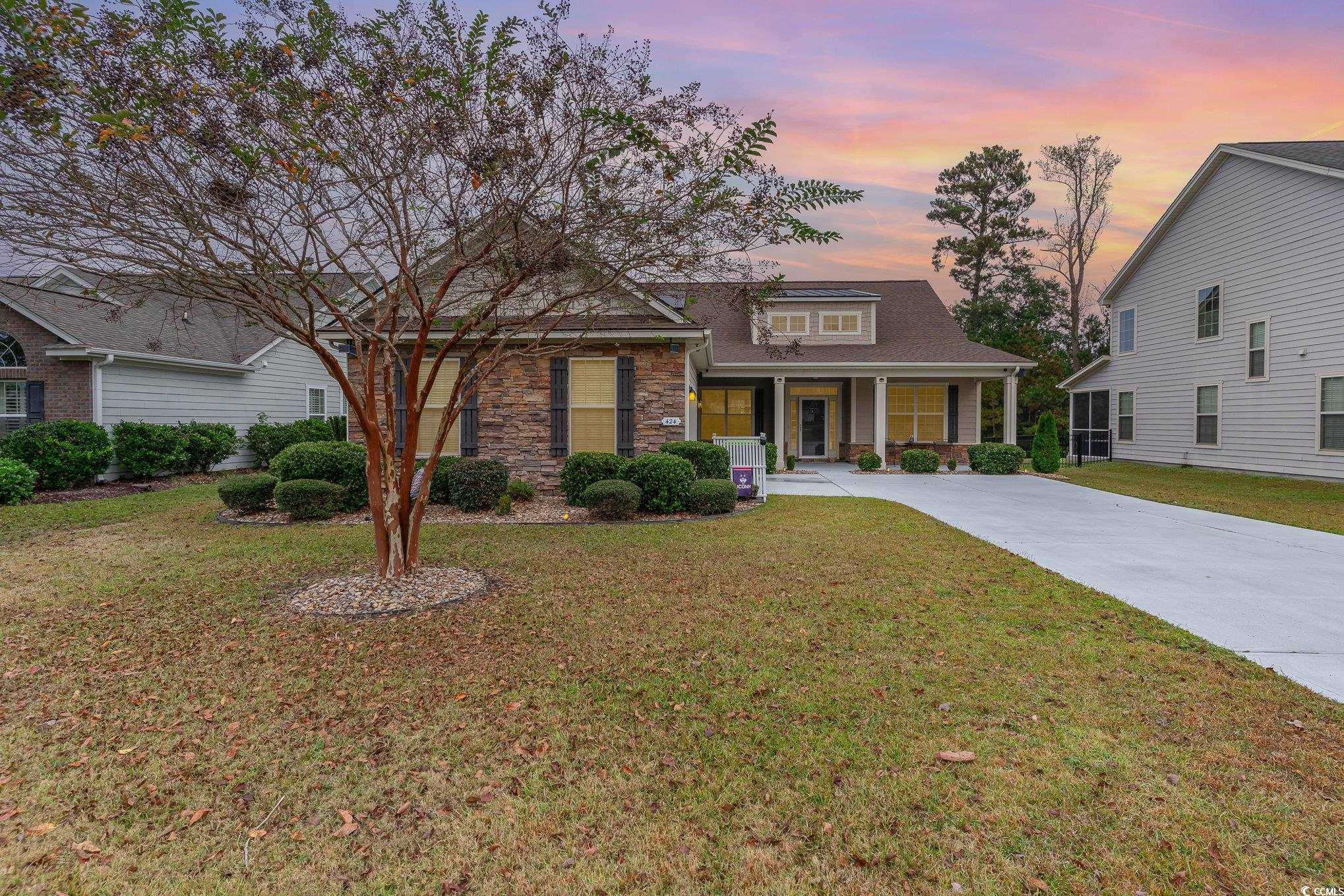 View of front of home featuring covered porch and