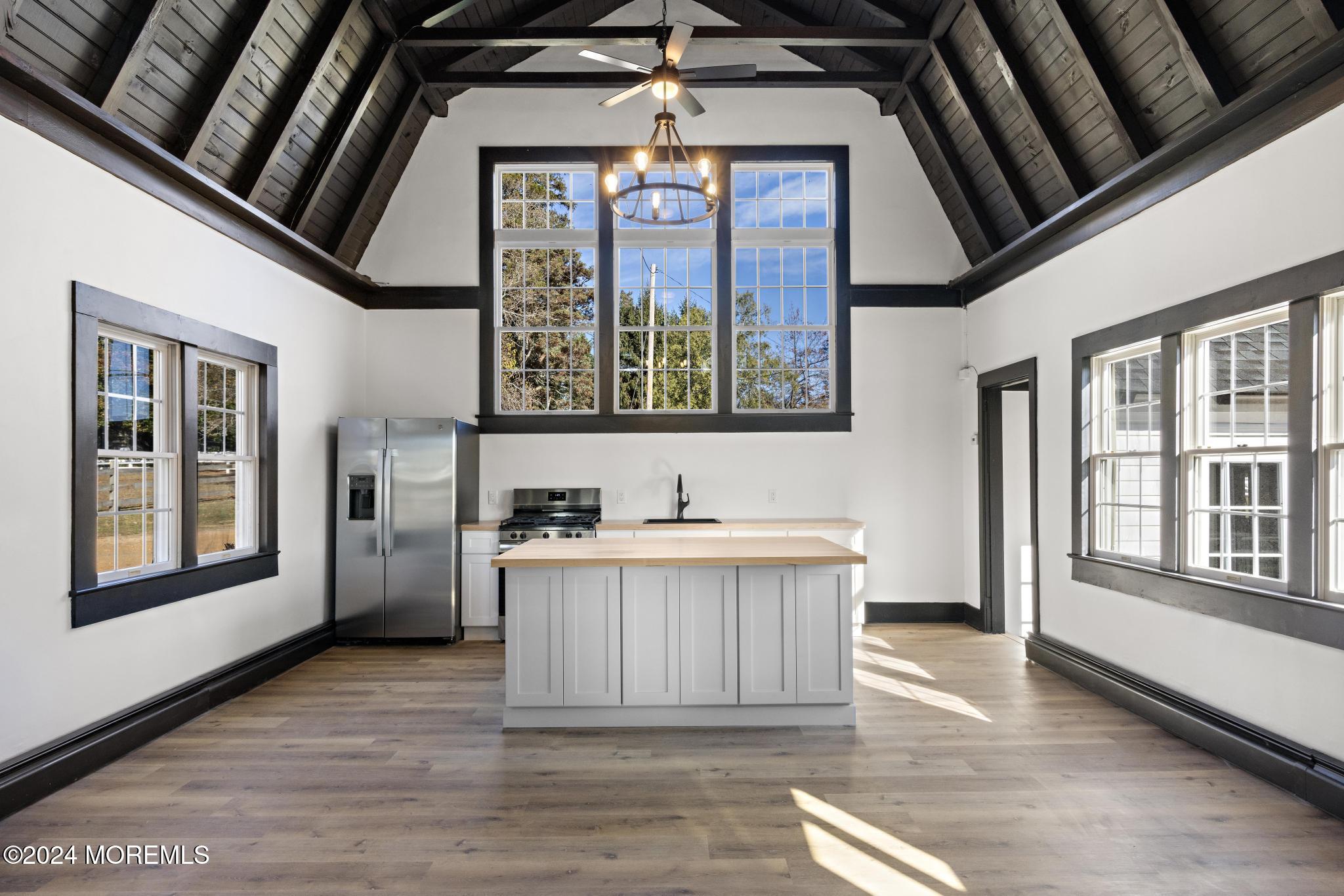 a view of an entryway with a kitchen