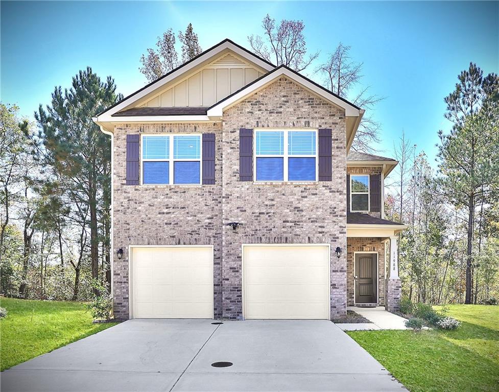 front view of a house with a yard