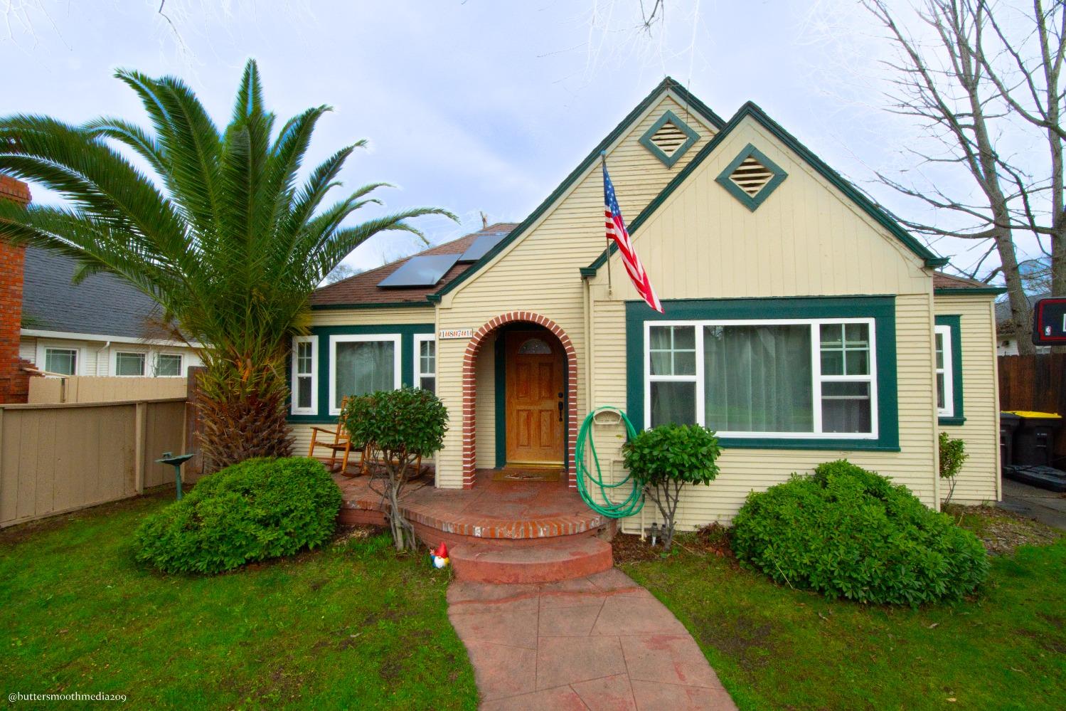 a front view of a house with garden