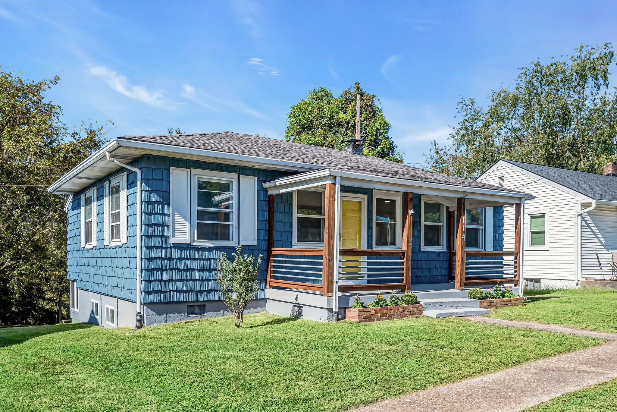 a front view of a house with a yard