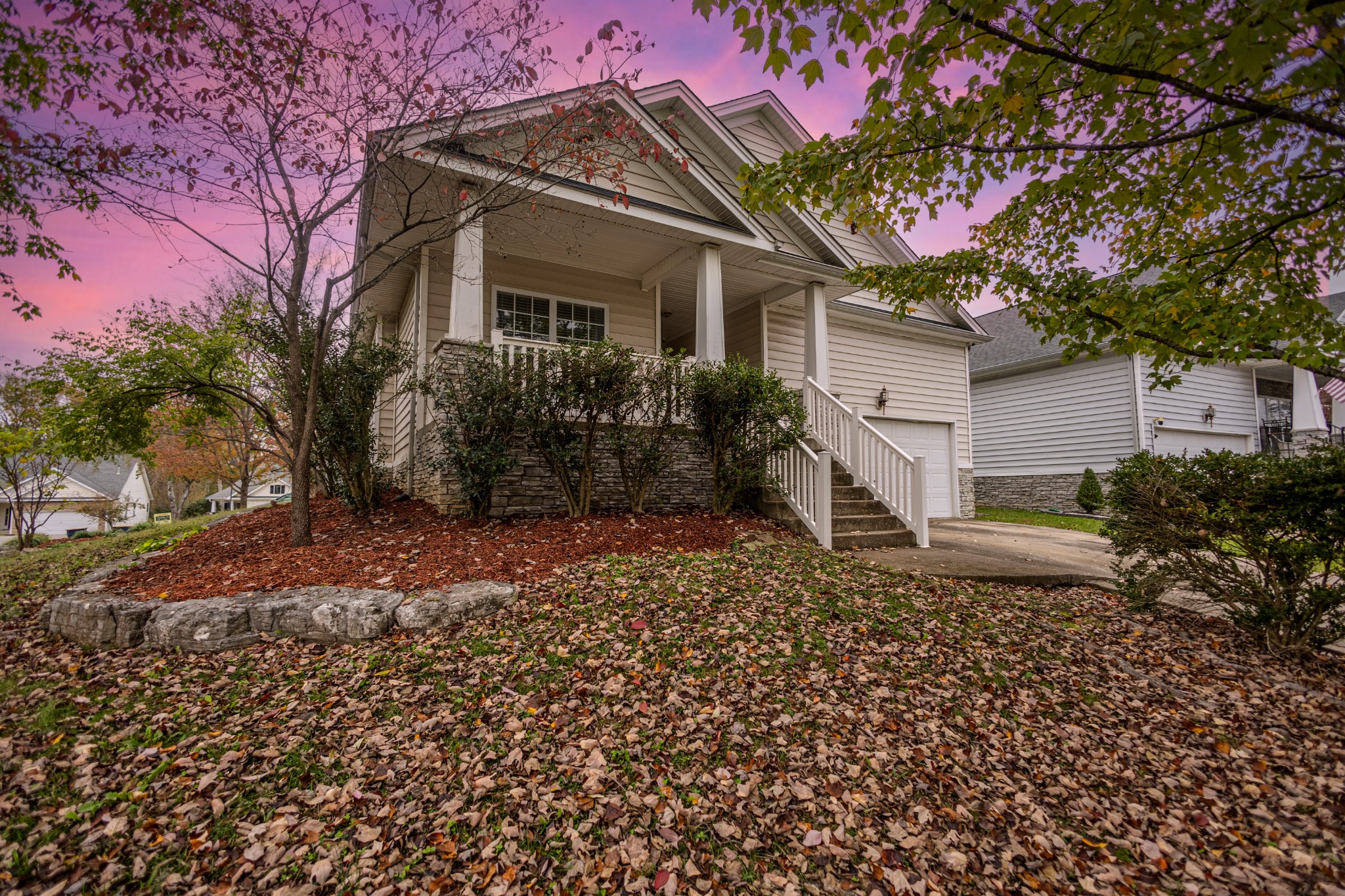 a front view of a house with garden