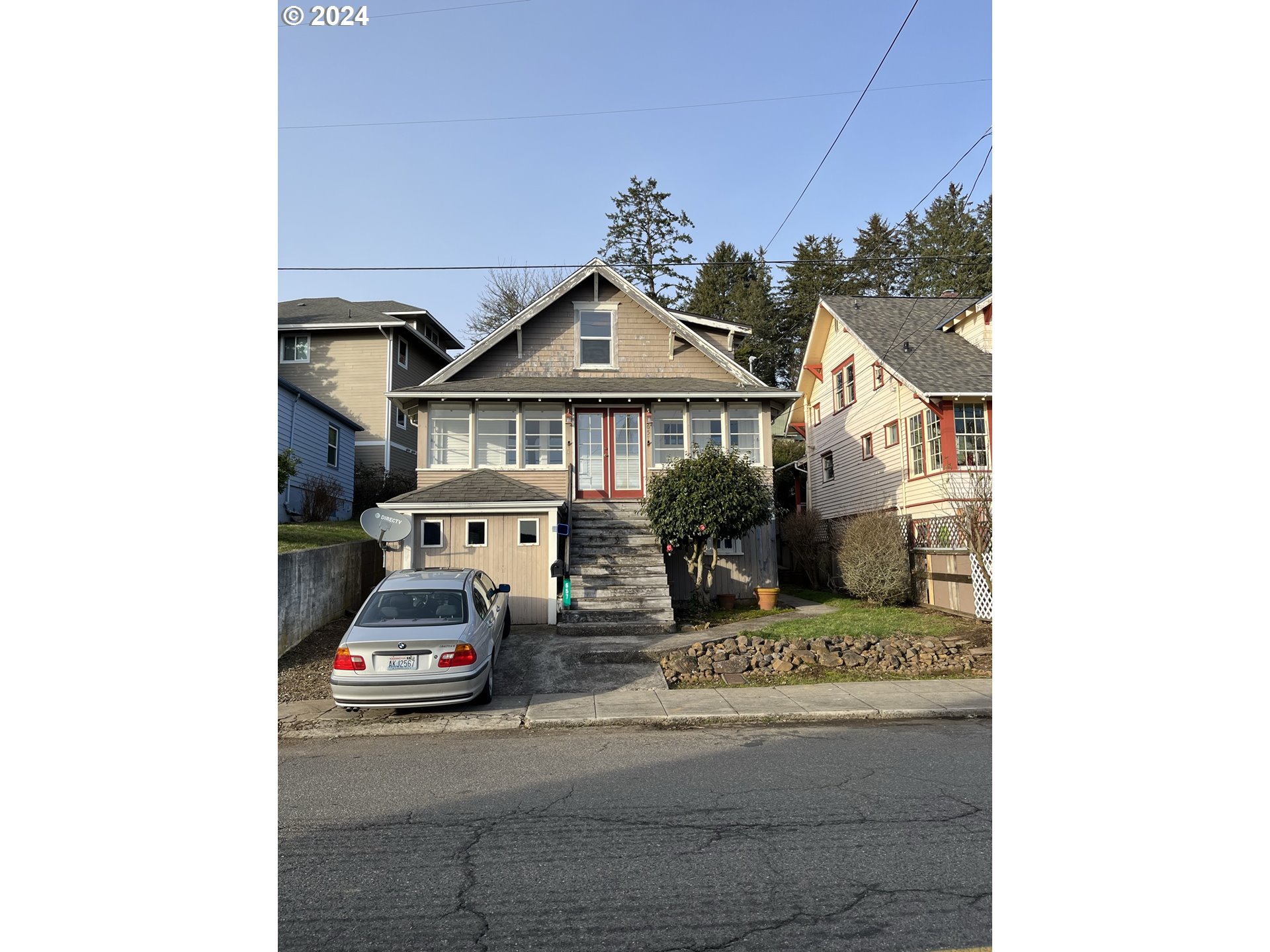 a car parked in front of a house